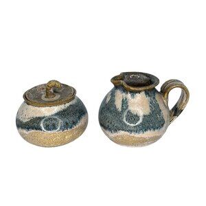 Clay pottery earthenware glazed lidded pot and small pitcher